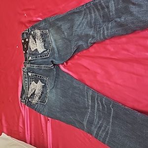 Miss me, jeans with angel wing on back.